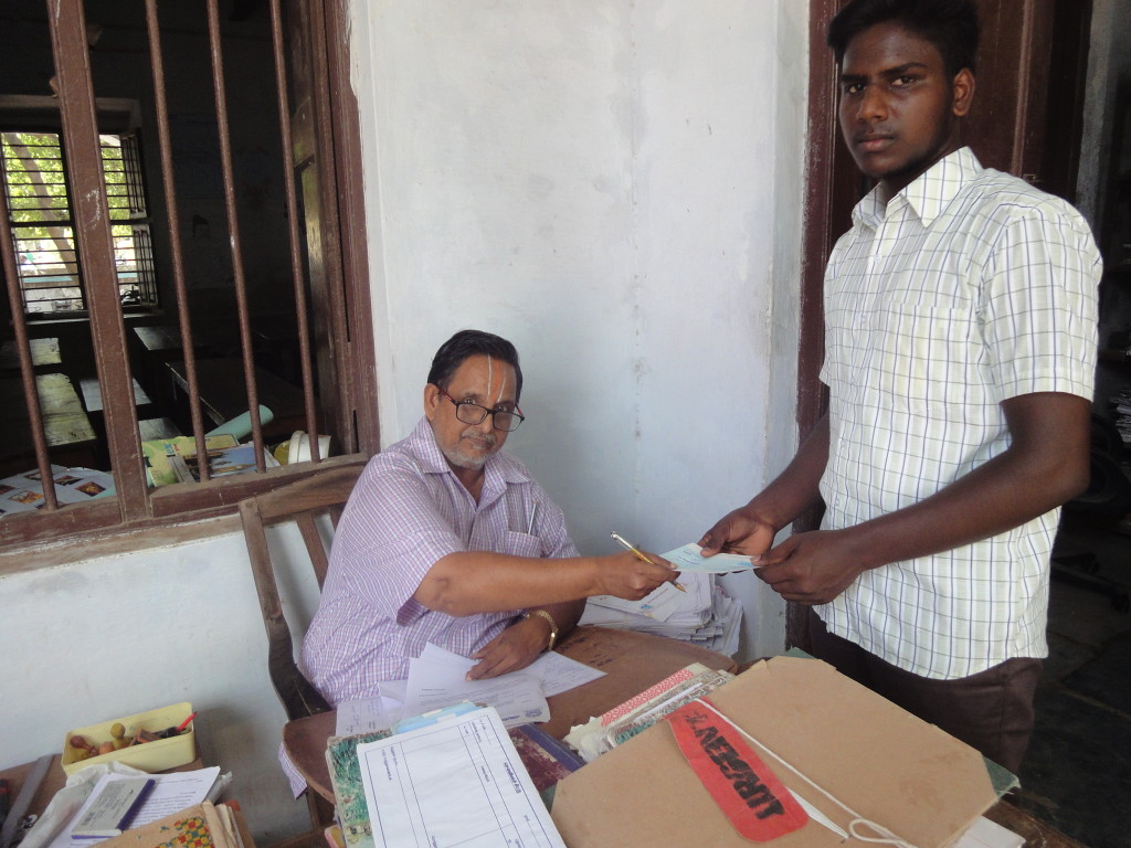 Trust representative handed over an educational-aid cheque for higher education of a rural poor boy, Manikanndan, studying in BCom first year.