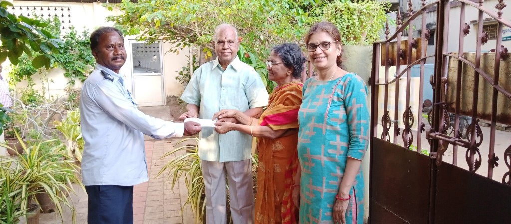 Parent of Sriram Charitable Trust handed over the cheque for education aid to the B.Tech second year student’s annual fees.