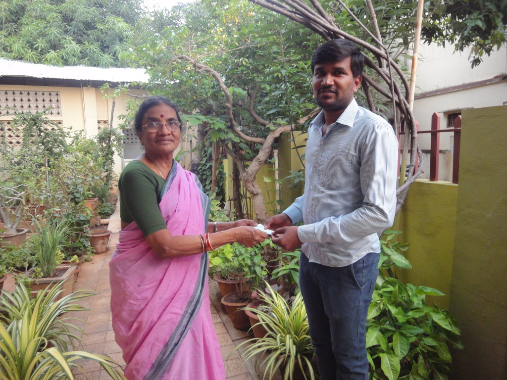Parent of the trustee handed over an educational-aid cheque for higher studies of a housemaid’s son