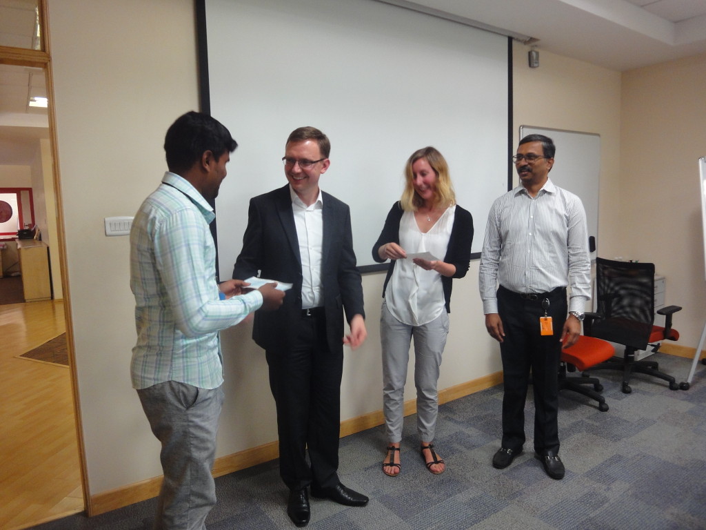 Eike Wannick, Team Manager Purchasing, and Kevin Goethling, Senior Manager Content Management (Books & Journals), handed over an educational-aid cheque to Shanmugam studying in B.Ed second year.